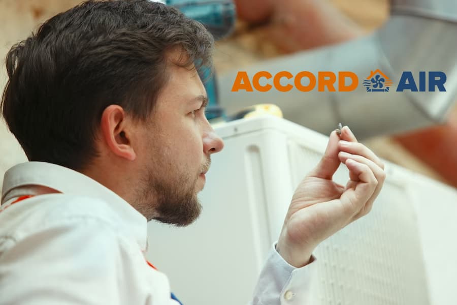 Man looking at a detail wit Accor Air Logo above it.