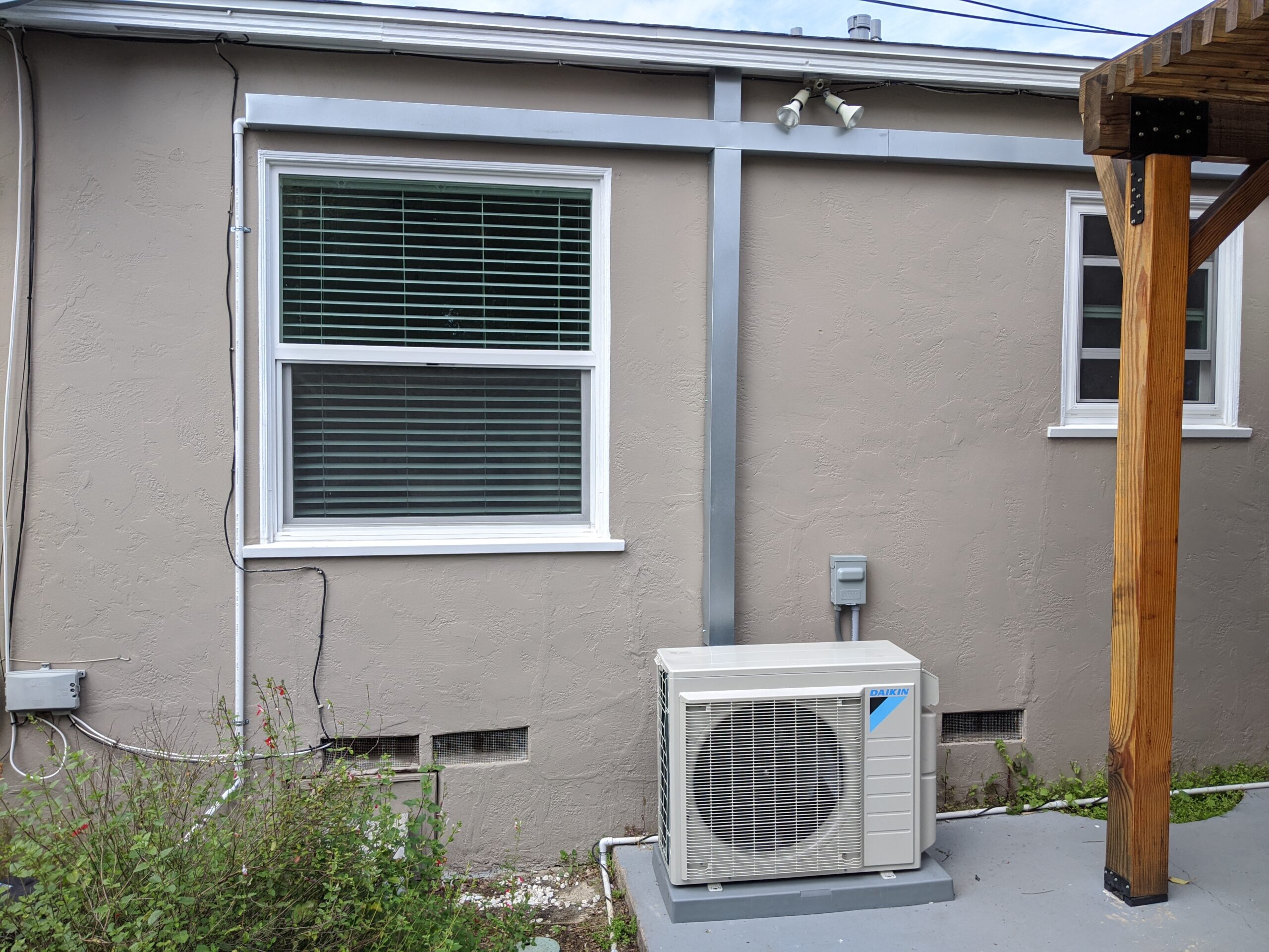 Daikin mini-split outdoor unit installed outside a house in Oceanside, CA.